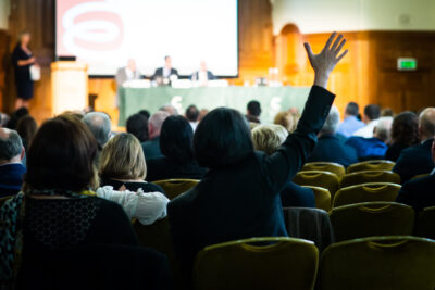 Raised Hand During Conference Q&A